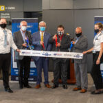 ribbon cutting offering Morgantown-D.C. flight